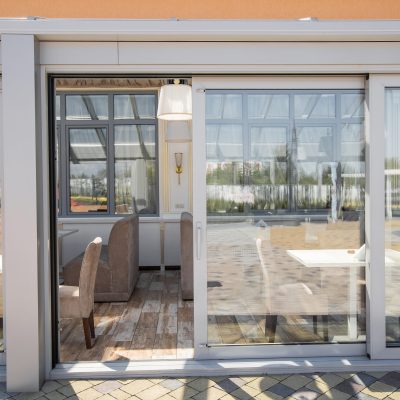 A bare office building interior. A modern panoramic window and view of Alabang skyline. Interior concept. Architectural background.