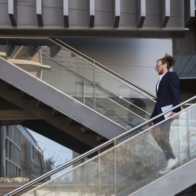 full-shot-man-holding-laptop